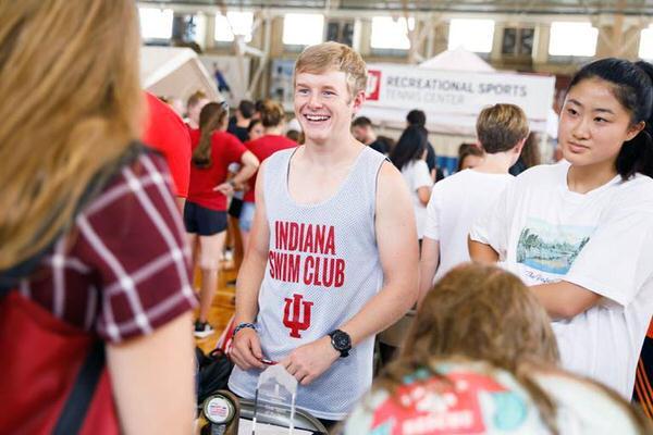 Male student at a student organization fair on the IU Bloomington campus.